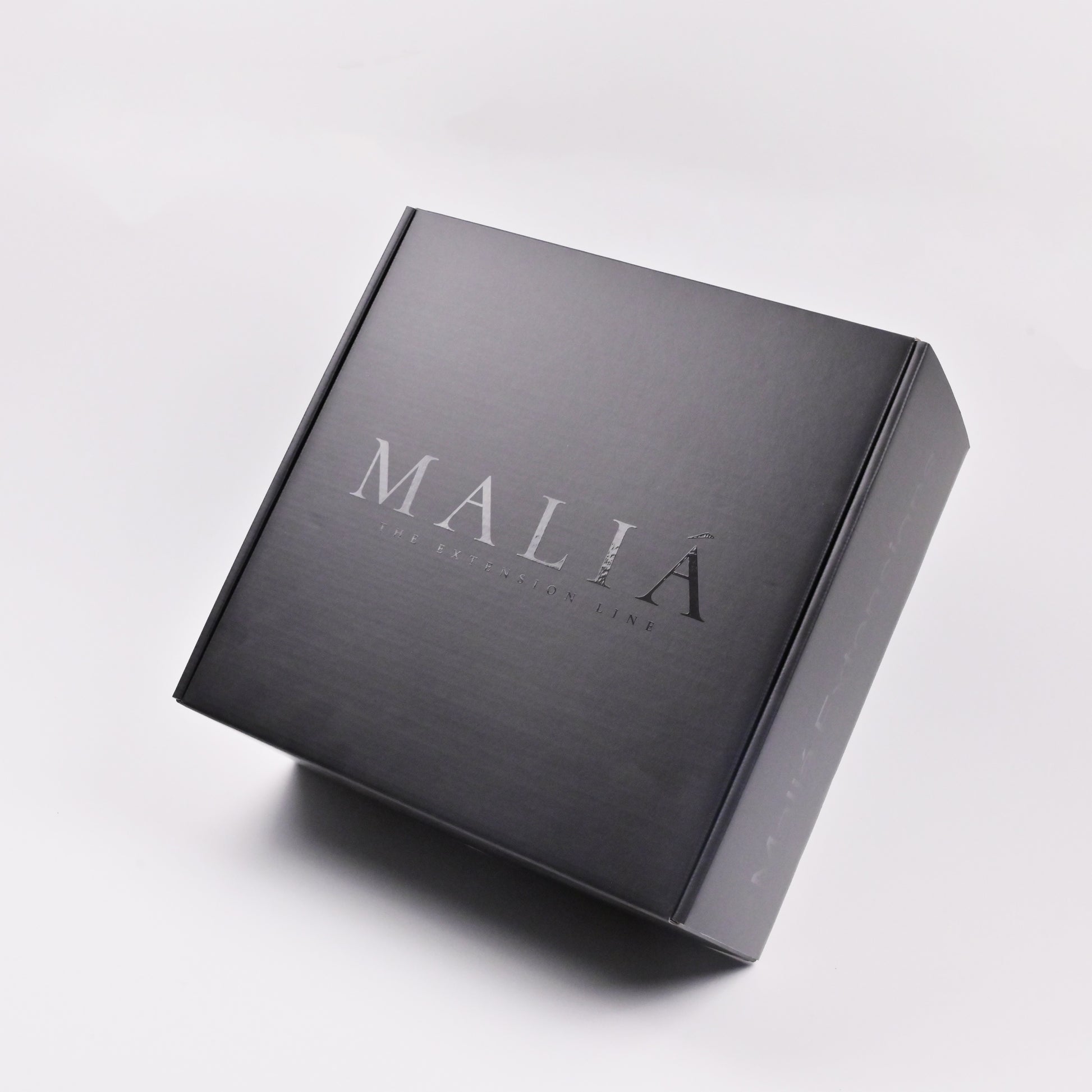 Minimalist matte black mailer box for e-commerce subscription box packaging