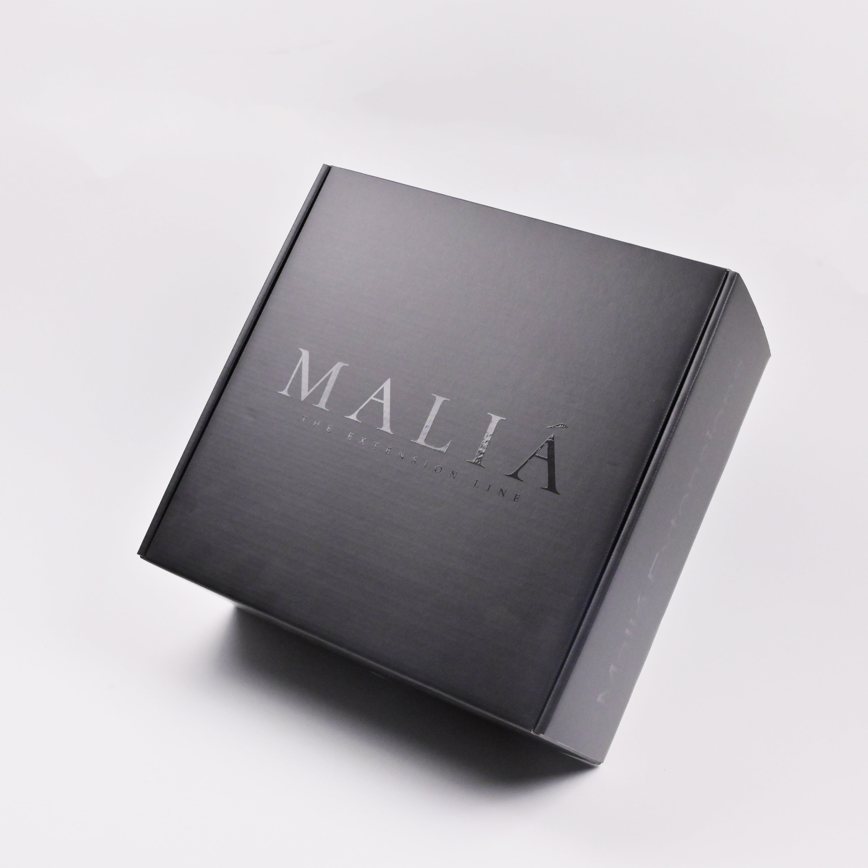 Minimalist matte black mailer box for e-commerce subscription box packaging