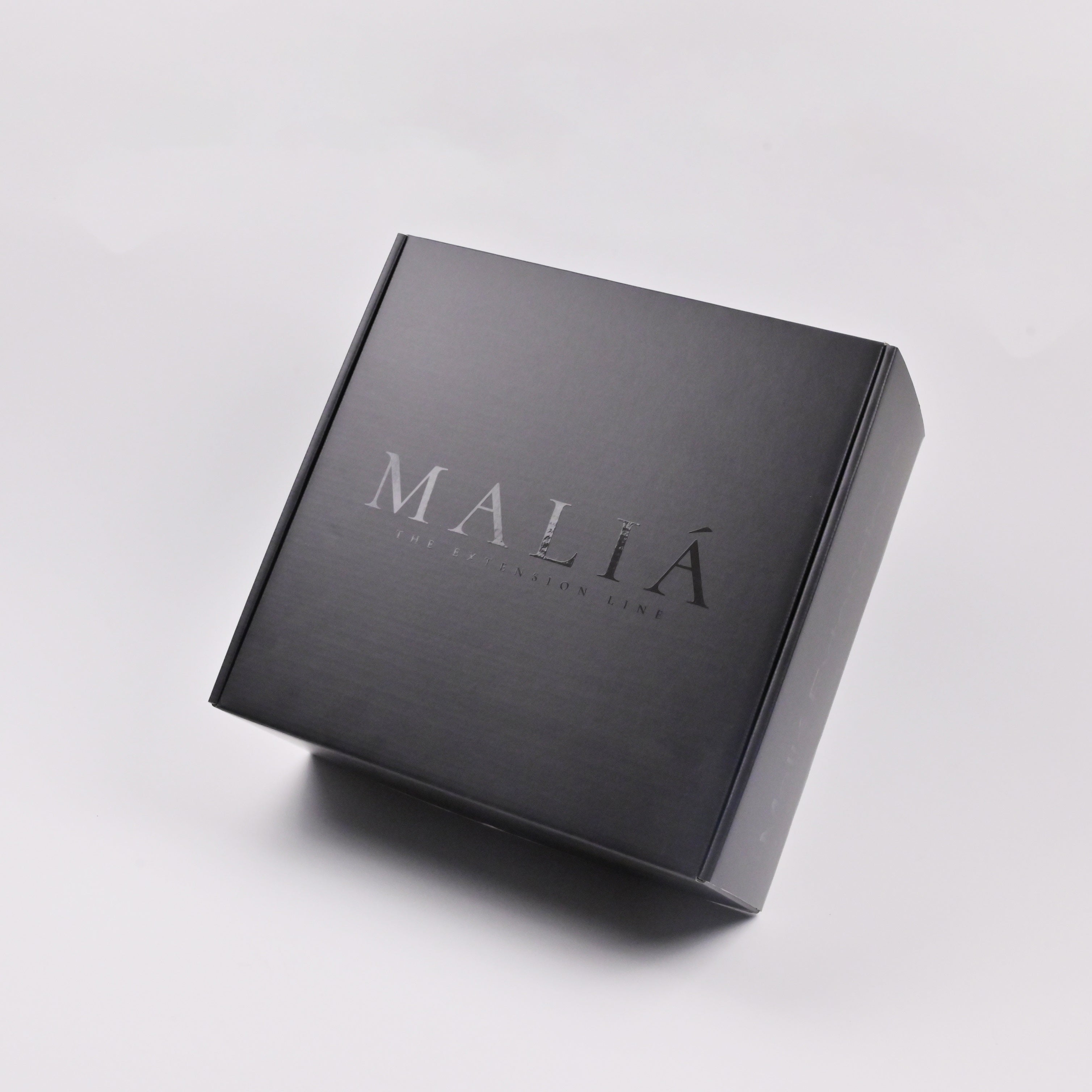 Black corrugated mailer box with clean flat surface for custom printing