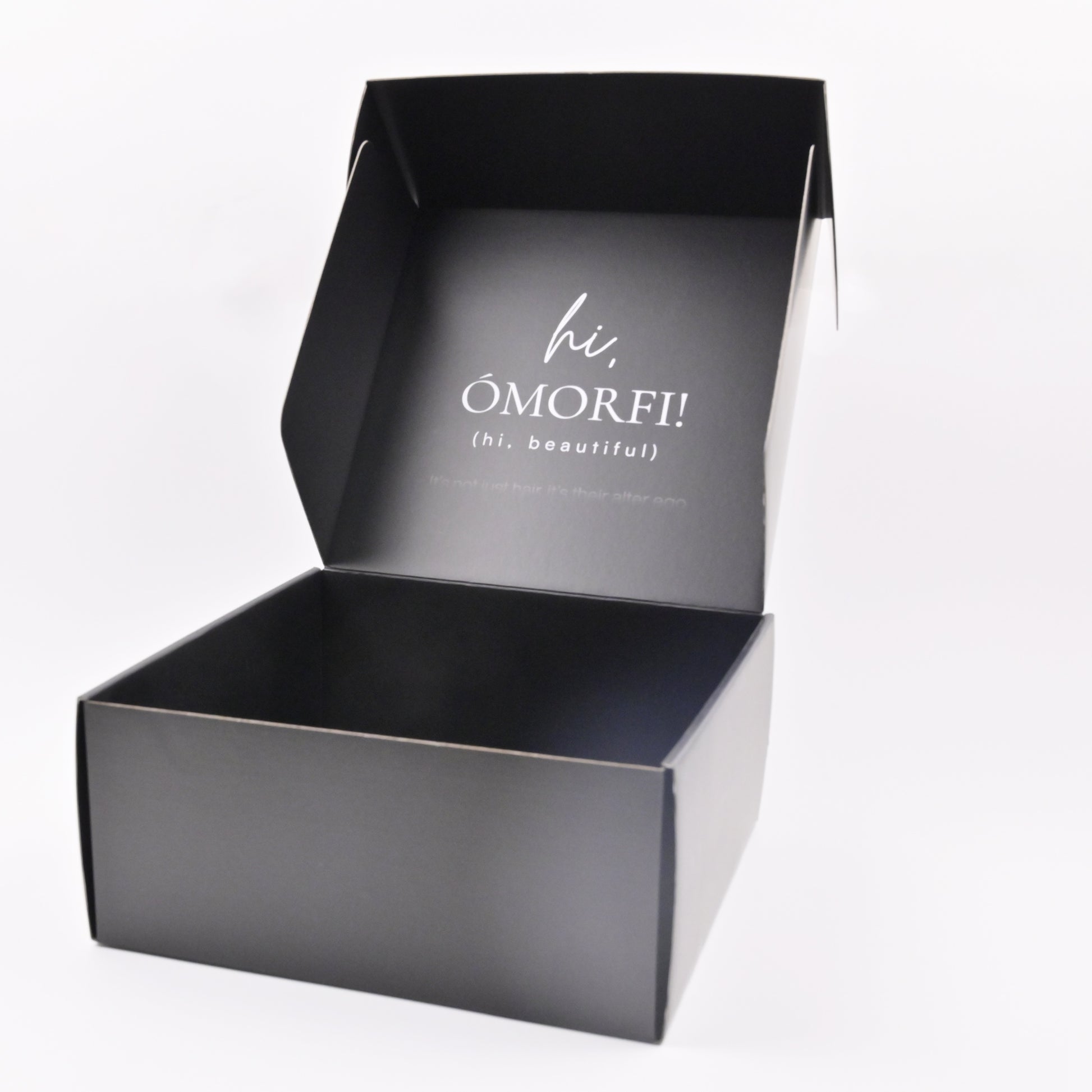 Matte black shipping box open lid showing interior structure
